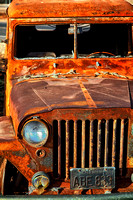 Rusty car by the road
